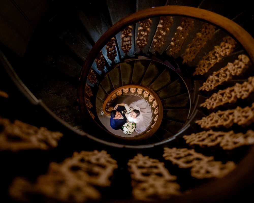 Overnewton Castle - Bride and Groom below spiral staircase