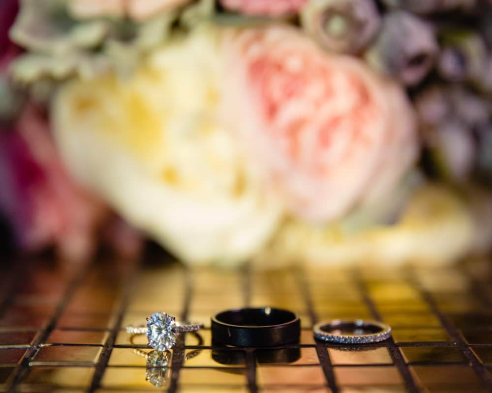 Wedding rings with bridal bouquet